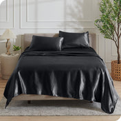 Satin sheets draped over a mattress