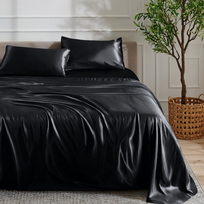 Satin sheet set on a bed with a plant and basket in the background