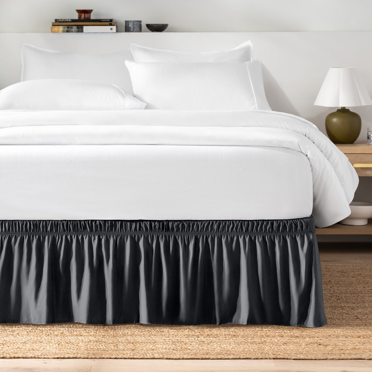 Bed with white bedding and a bed skirt.