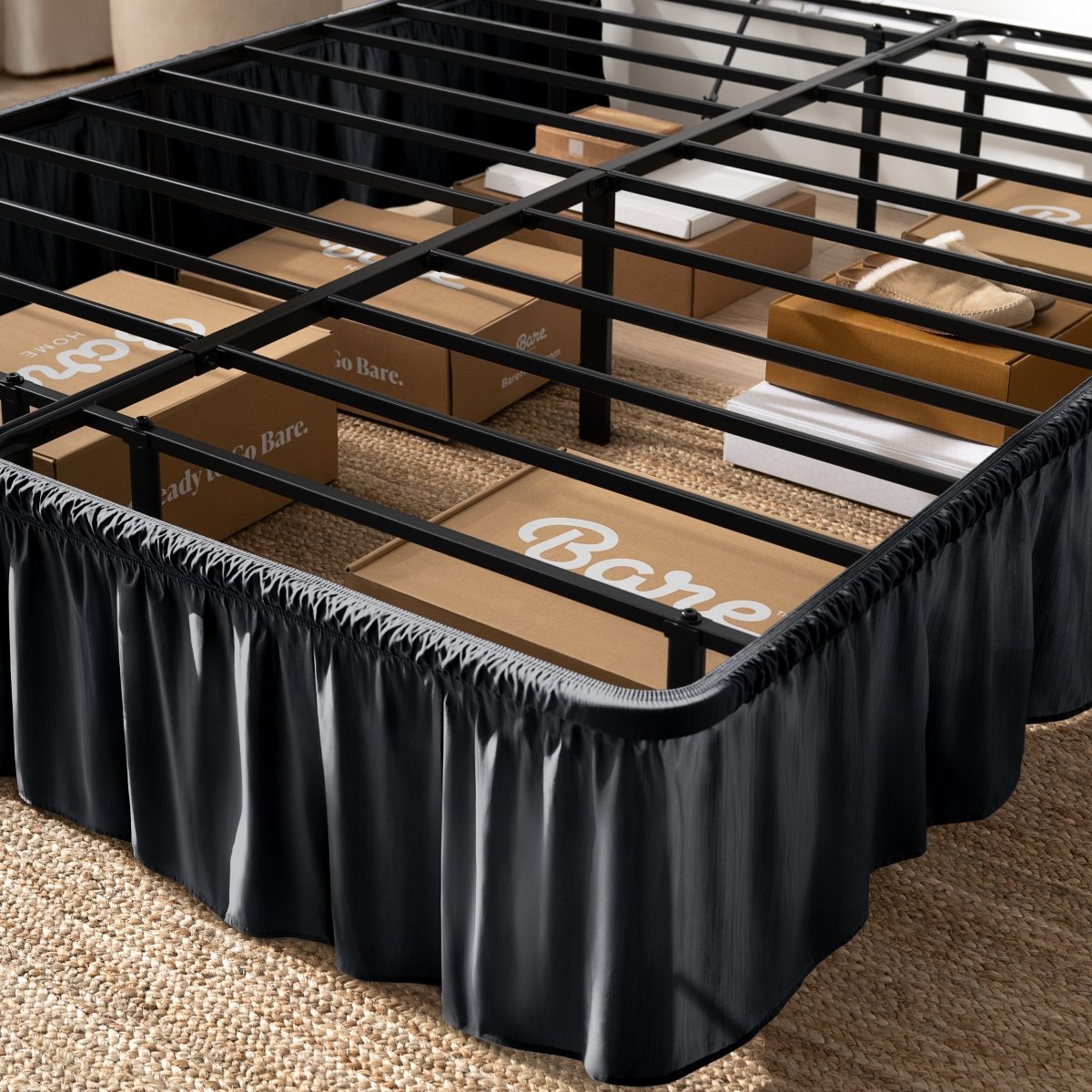 Bed frame with bed skirt and Bare Home boxes underneath.