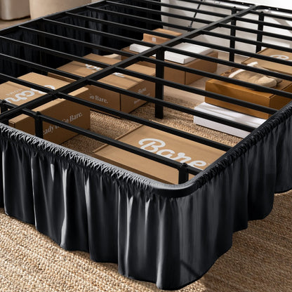 Bed frame with bed skirt and Bare Home boxes underneath.