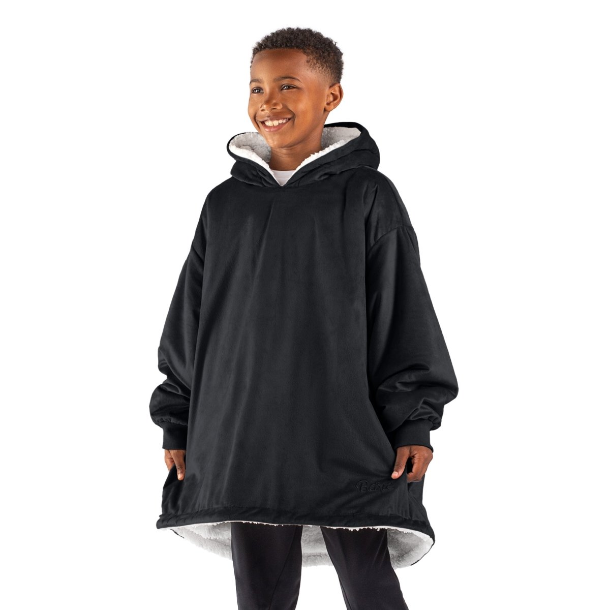 A child with a sherpa wearable blanket on