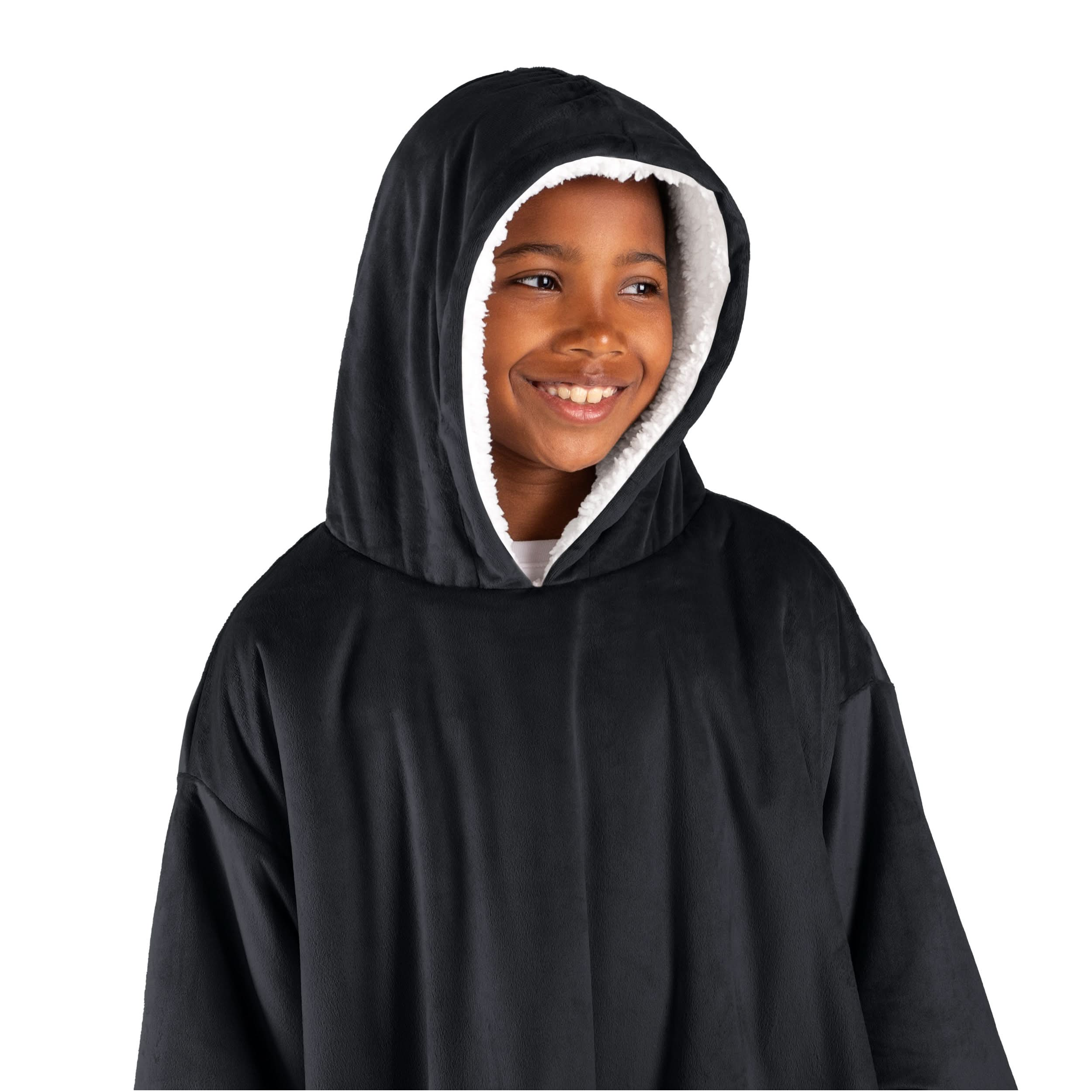 A boy has a wearable blanket on