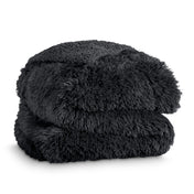 A shaggy faux fur blanket folded