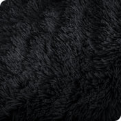 Close up of the soft texture of a shaggy faux fur sherpa blanket