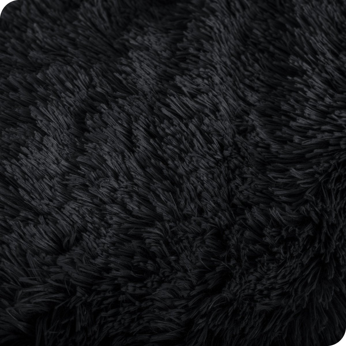 Close up of the soft texture of a shaggy faux fur sherpa blanket
