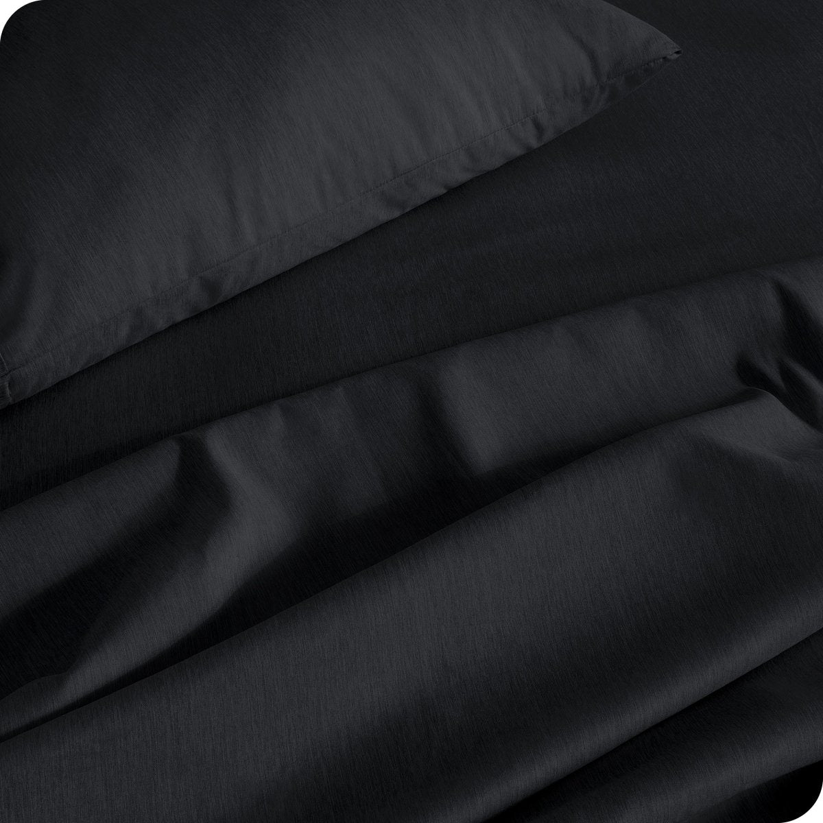 Close up of a heather sheet set on a bed