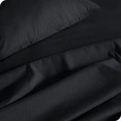 Close up of a heather sheet set on a bed