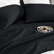 Bedding set on a bed with a bowl of cereal on a white background