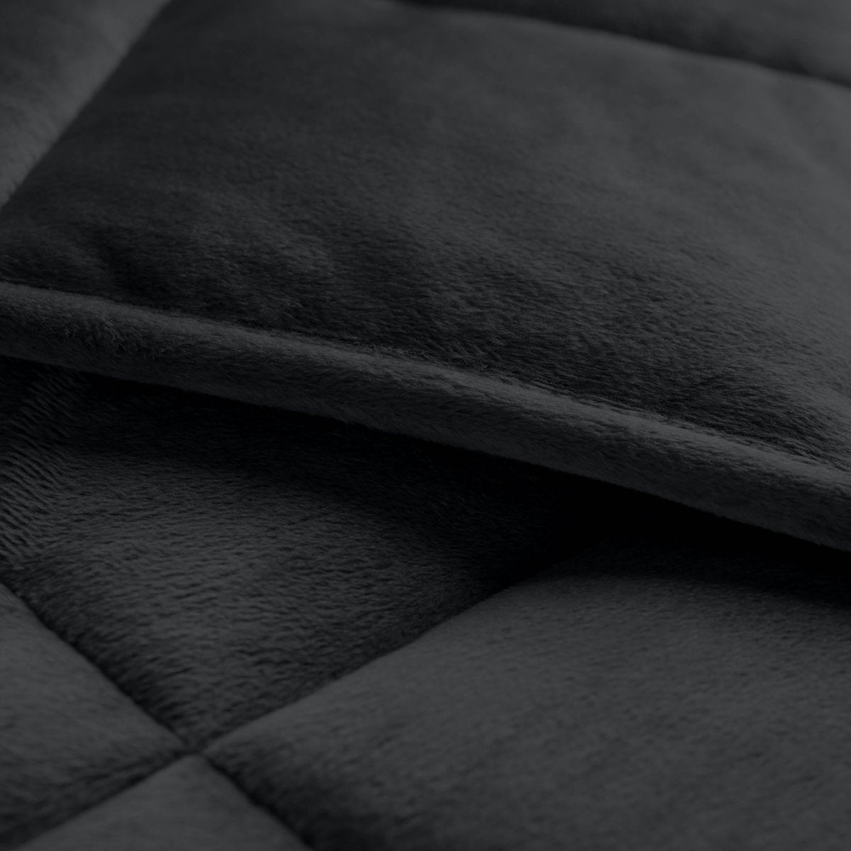 Close-up of a weighted blanket showing the stitching and texture