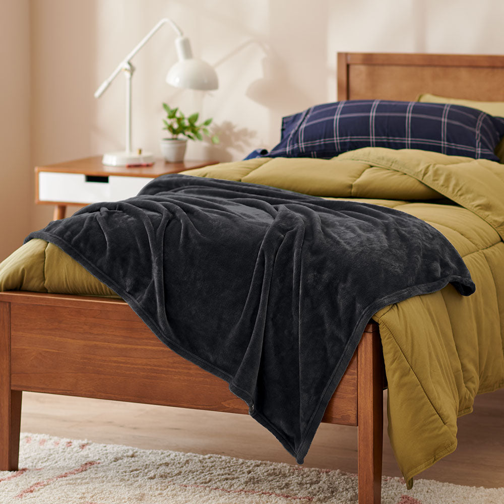Black Throw Blanket on a dorm bed
