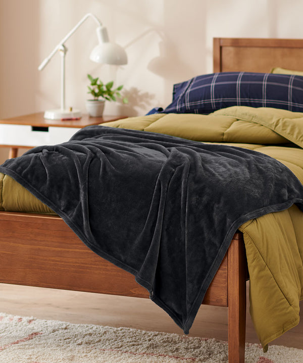 Black Throw Blanket on a dorm bed