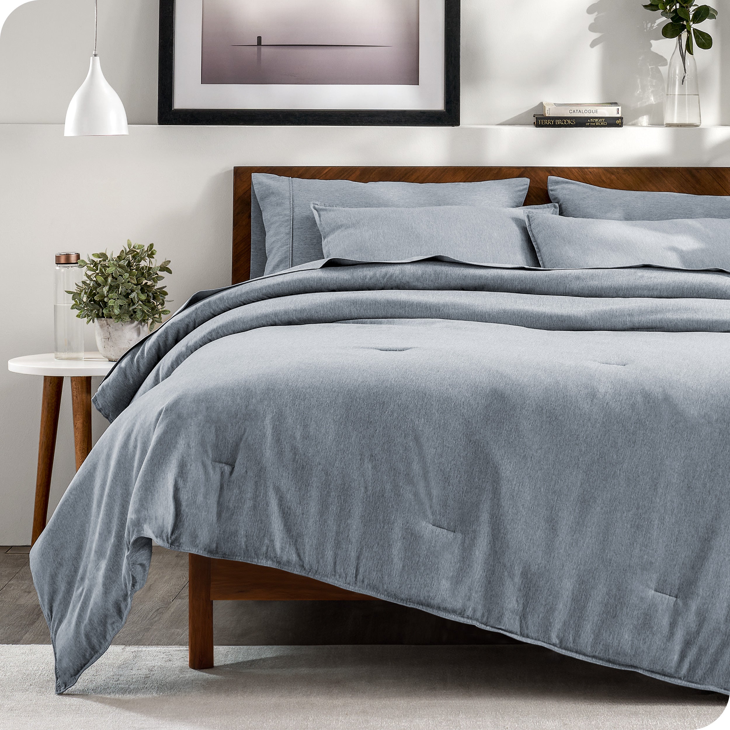 Modern bedroom with a heather grey complete bedding set on the bed
