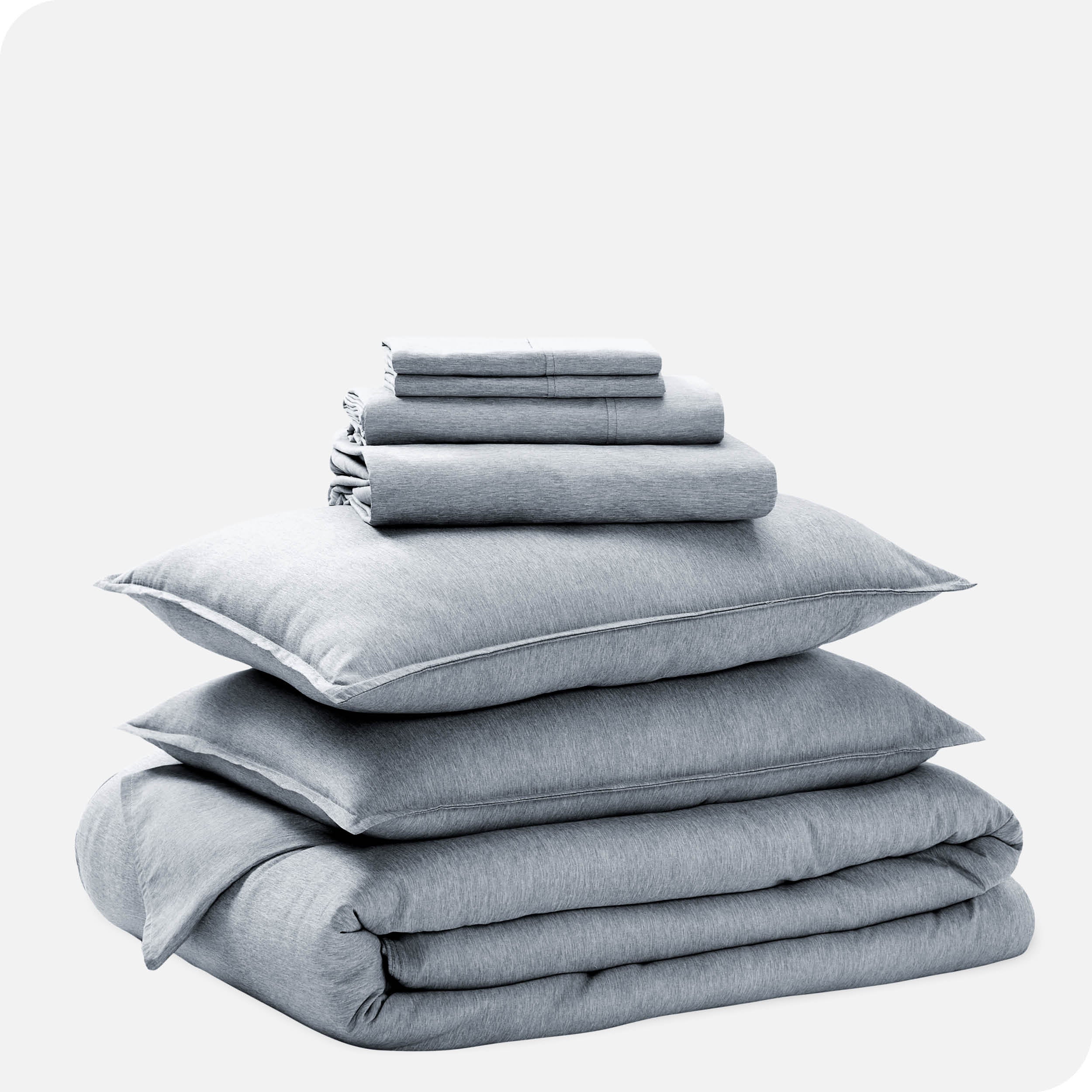 A heathered bedding set folded and stacked.