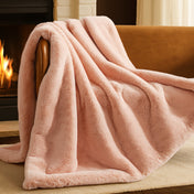 Blanket draped over a chair in front of a fireplace