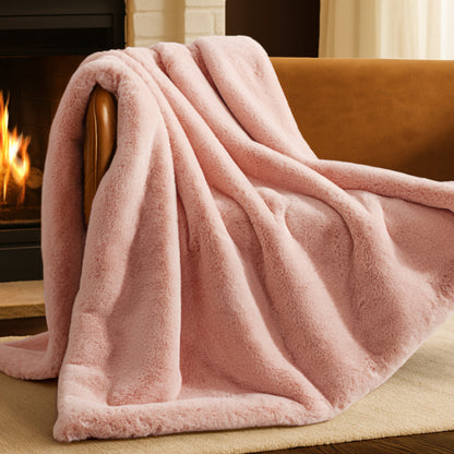 Blanket draped over a chair in front of a fireplace