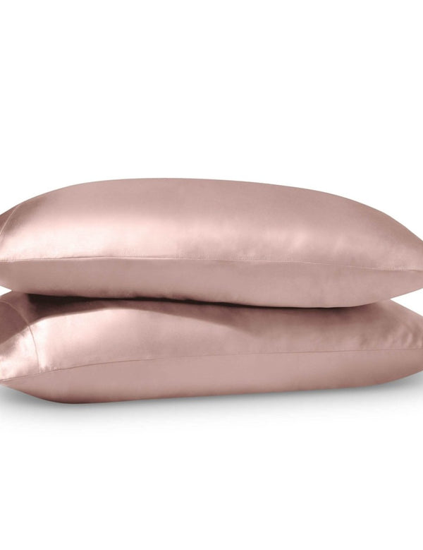 2 satin pillowcases on pillows stacked