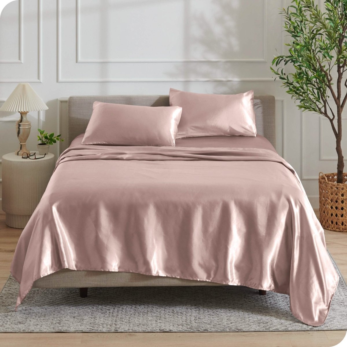 Satin sheets drapped over a mattress