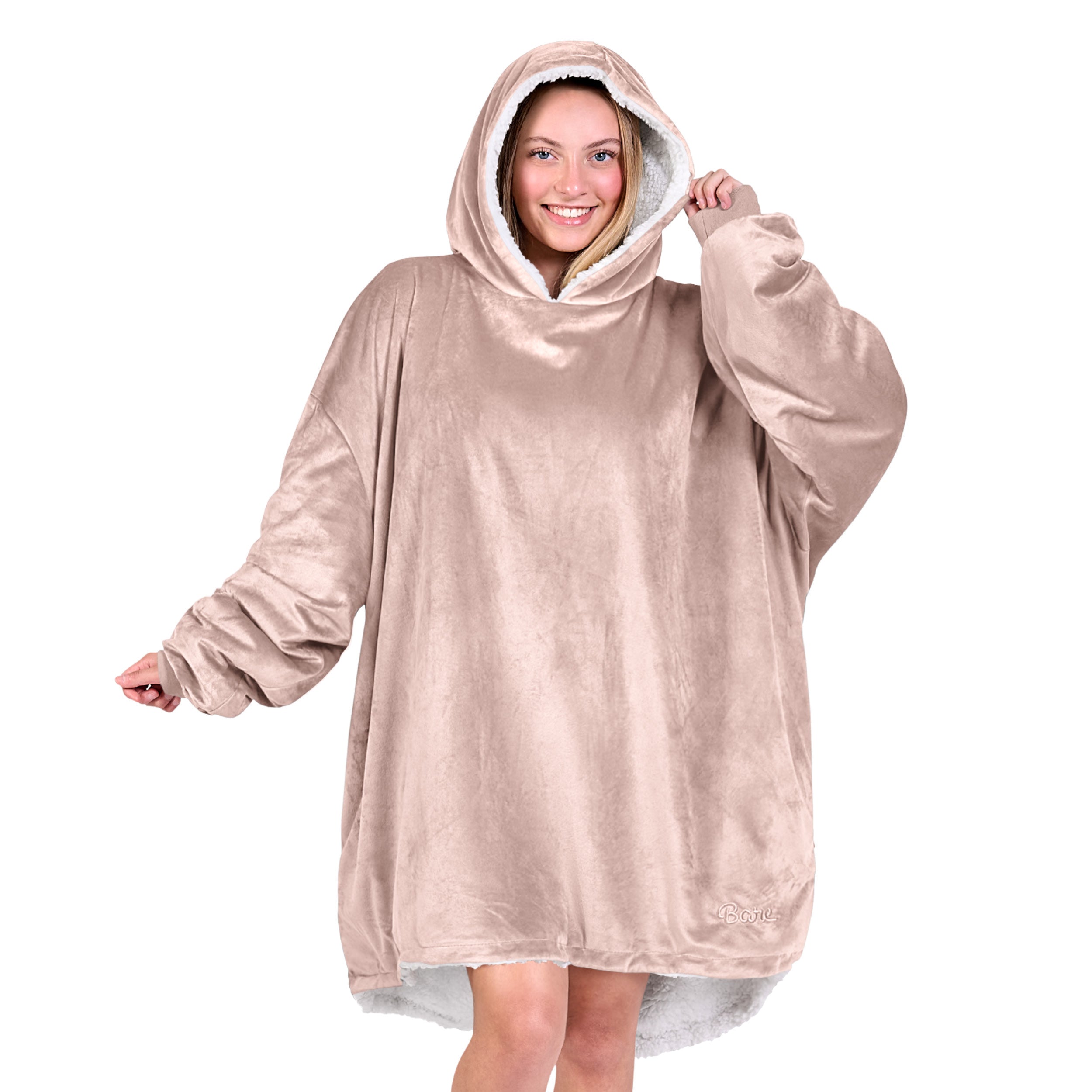 An adult with a sherpa wearable blanket on