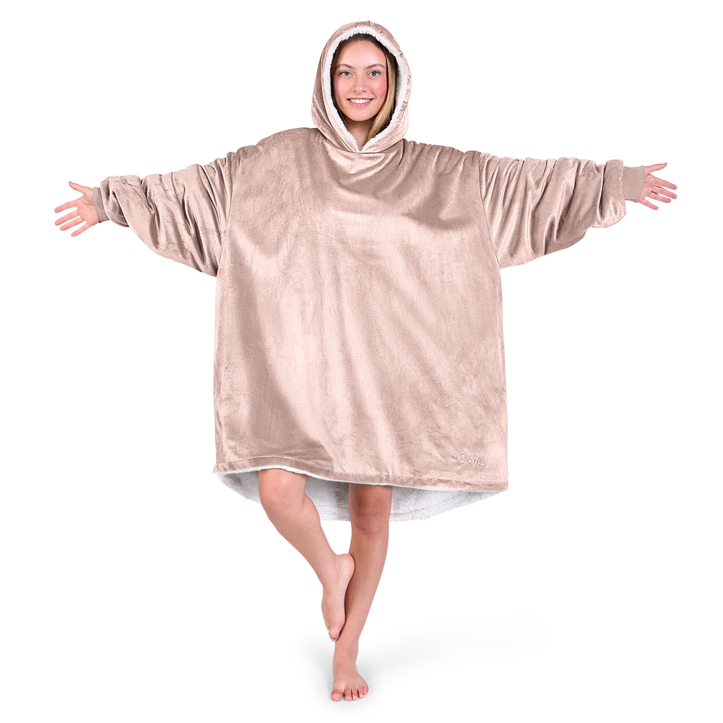 An adult with a sherpa wearable blanket on