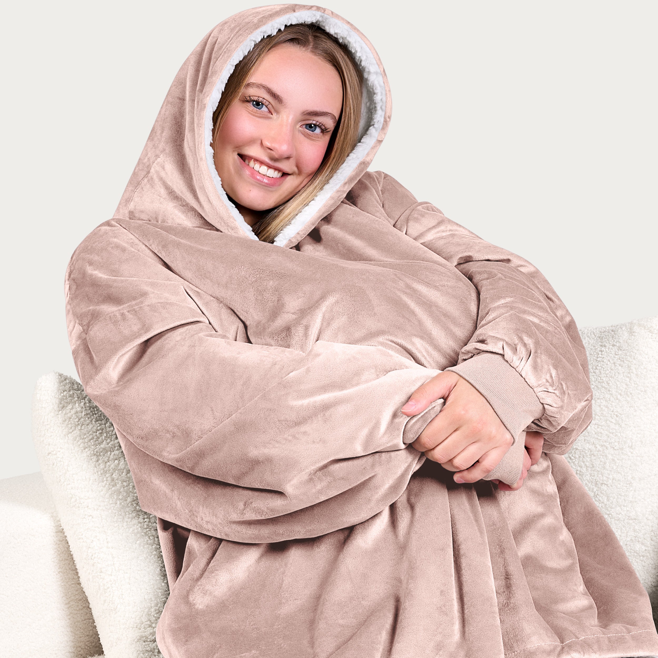 An adult with a sherpa wearable blanket on