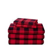 Stack of flannel sheets and pillowcases on a white background