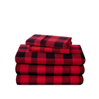 Stack of flannel sheets and pillowcases on a white background