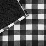 Close-up of both sides of a printed sherpa blanket