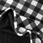Close-up of both sides of a printed sherpa blanket