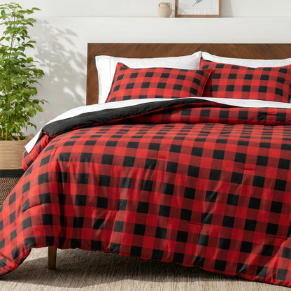 Bedding set on a bed in a bedroom with a side table and lamp.