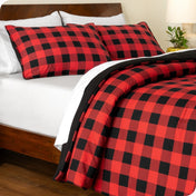 Buffalo plaid comforter set on a bed with white sheets