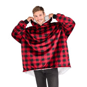 An adult with a sherpa wearable blanket on