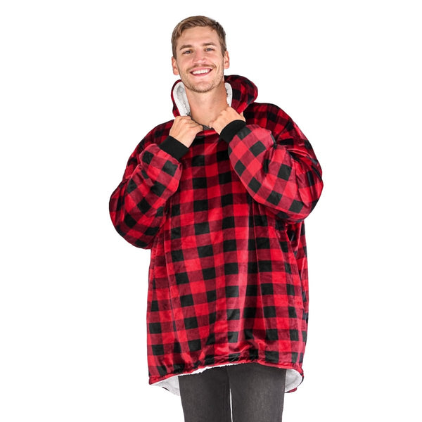 An adult with a sherpa wearable blanket on
