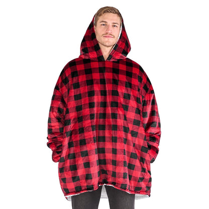 Person wearing a hooded blanket on a white background