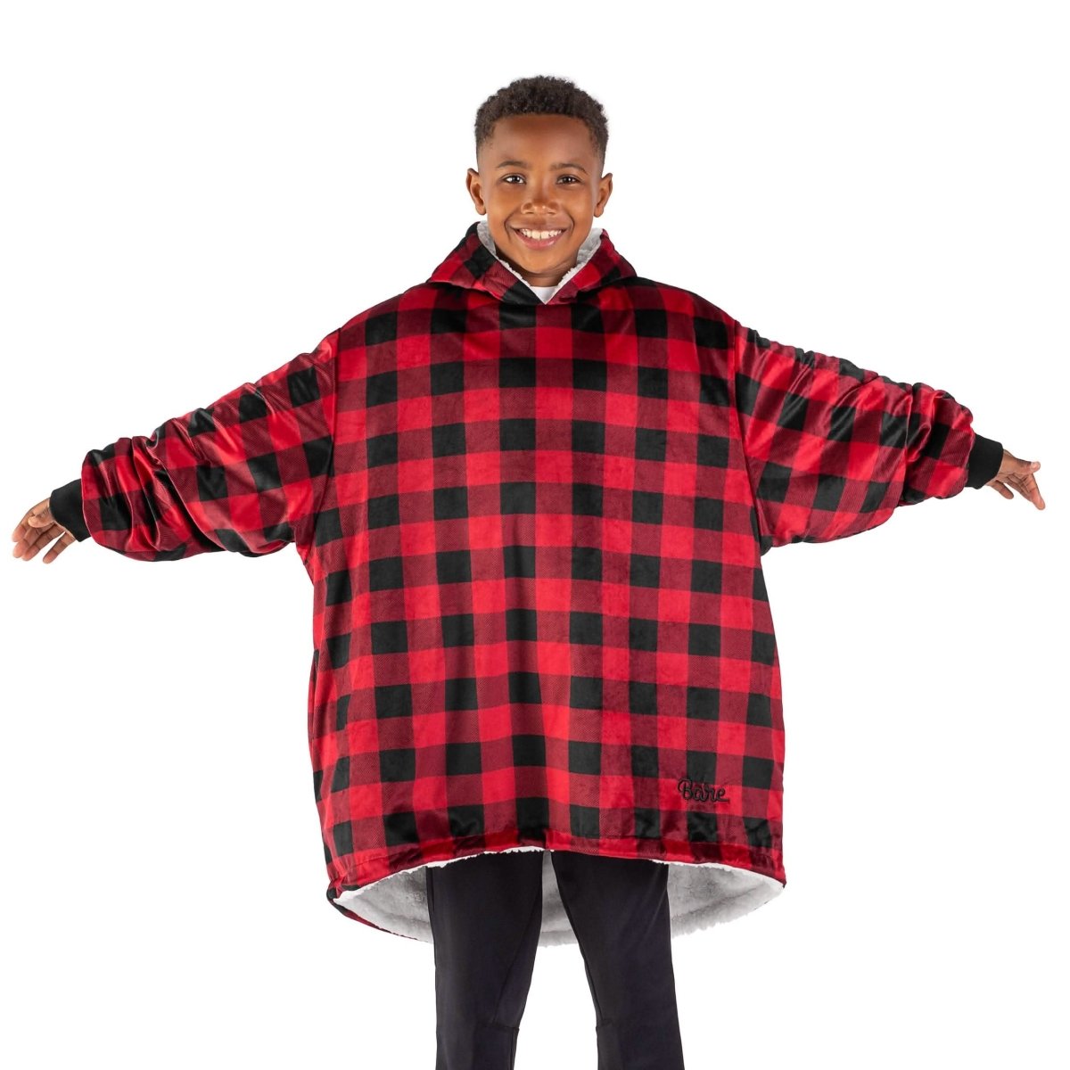 A child with a sherpa wearable blanket on