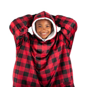A child with a wearable blanket on