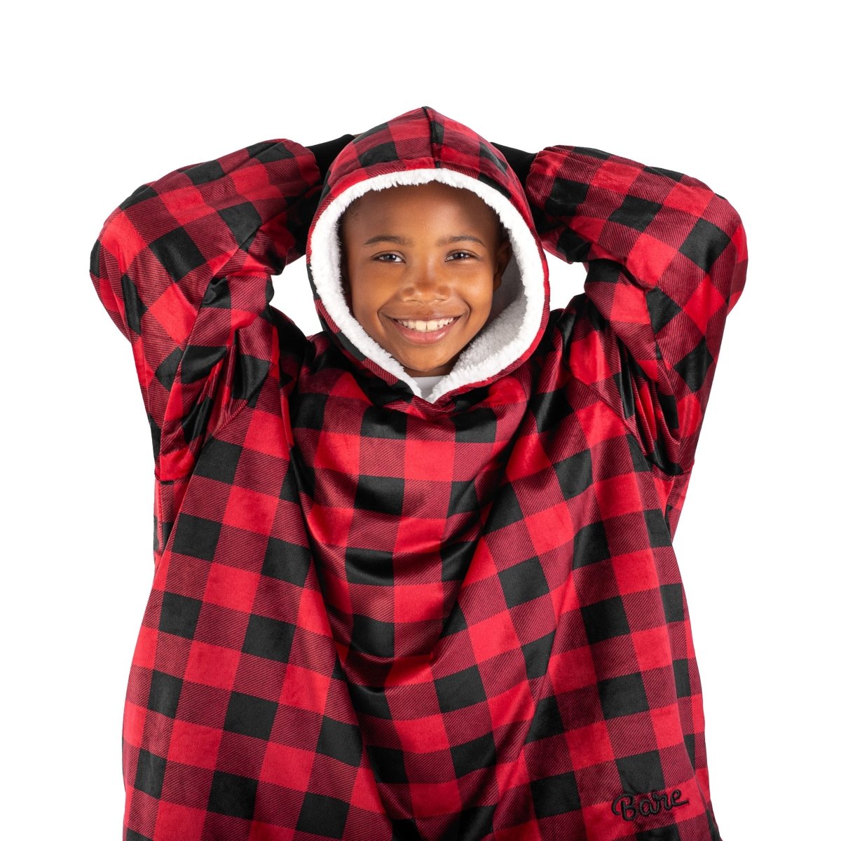 A child with a sherpa wearable blanket on
