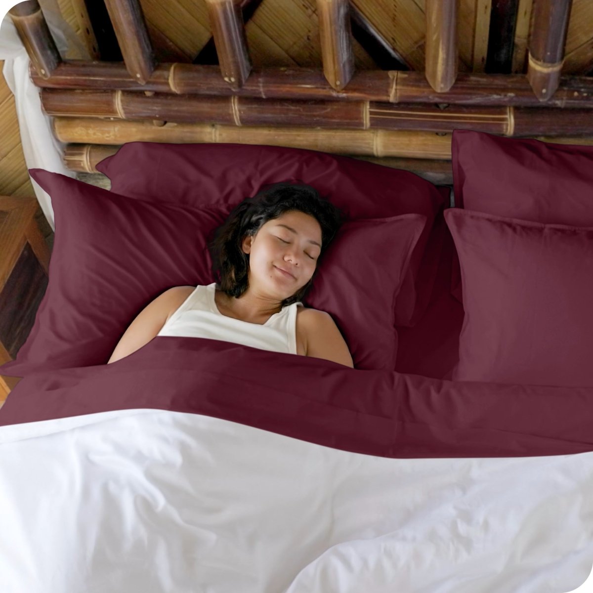 A woman sleeping in a bed made with bamboo sheets