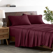 A stylish bed with bamboo sheets and pillowcases, showcasing a sophisticated and elegant bedroom setting.