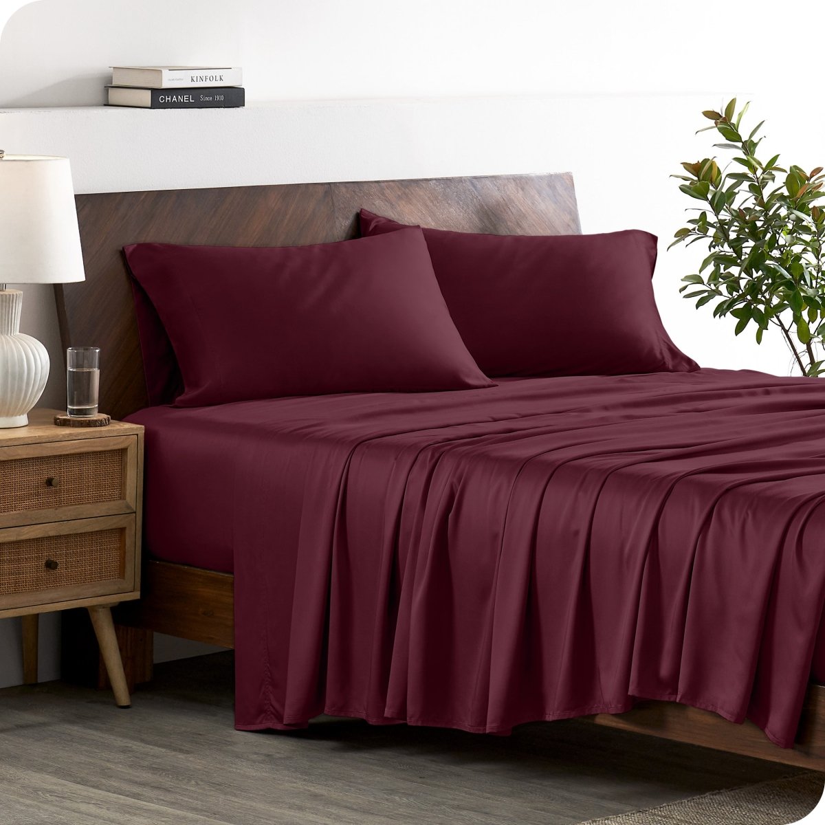 A stylish bed with bamboo sheets and pillowcases, showcasing a sophisticated and elegant bedroom setting.