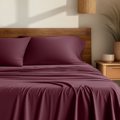 Bamboo sheets on a bed with a wooden headboard