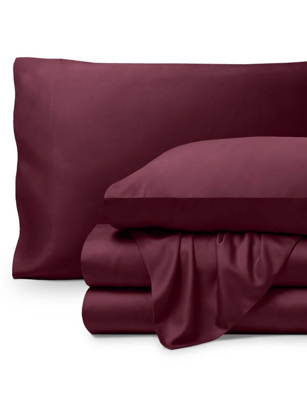 Bamboo pillowcases and sheets set on a white background