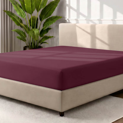 Ultra soft fitted sheet on a mattress with the sun shining into the bedroom