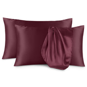 Two satin pillowcases on a white background