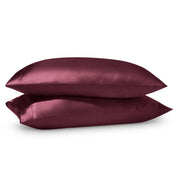 2 satin pillowcases on pillows stacked