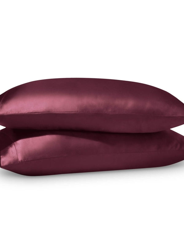 2 satin pillowcases on pillows stacked