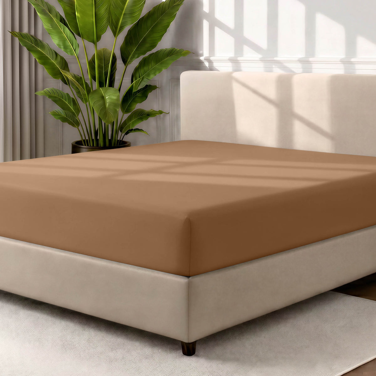 Ultra soft fitted sheet on a mattress with the sun shining into the bedroom