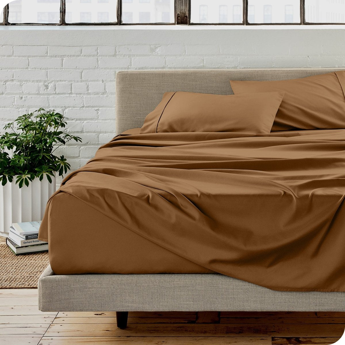 A modern bedroom with microfiber sheets on the mattress