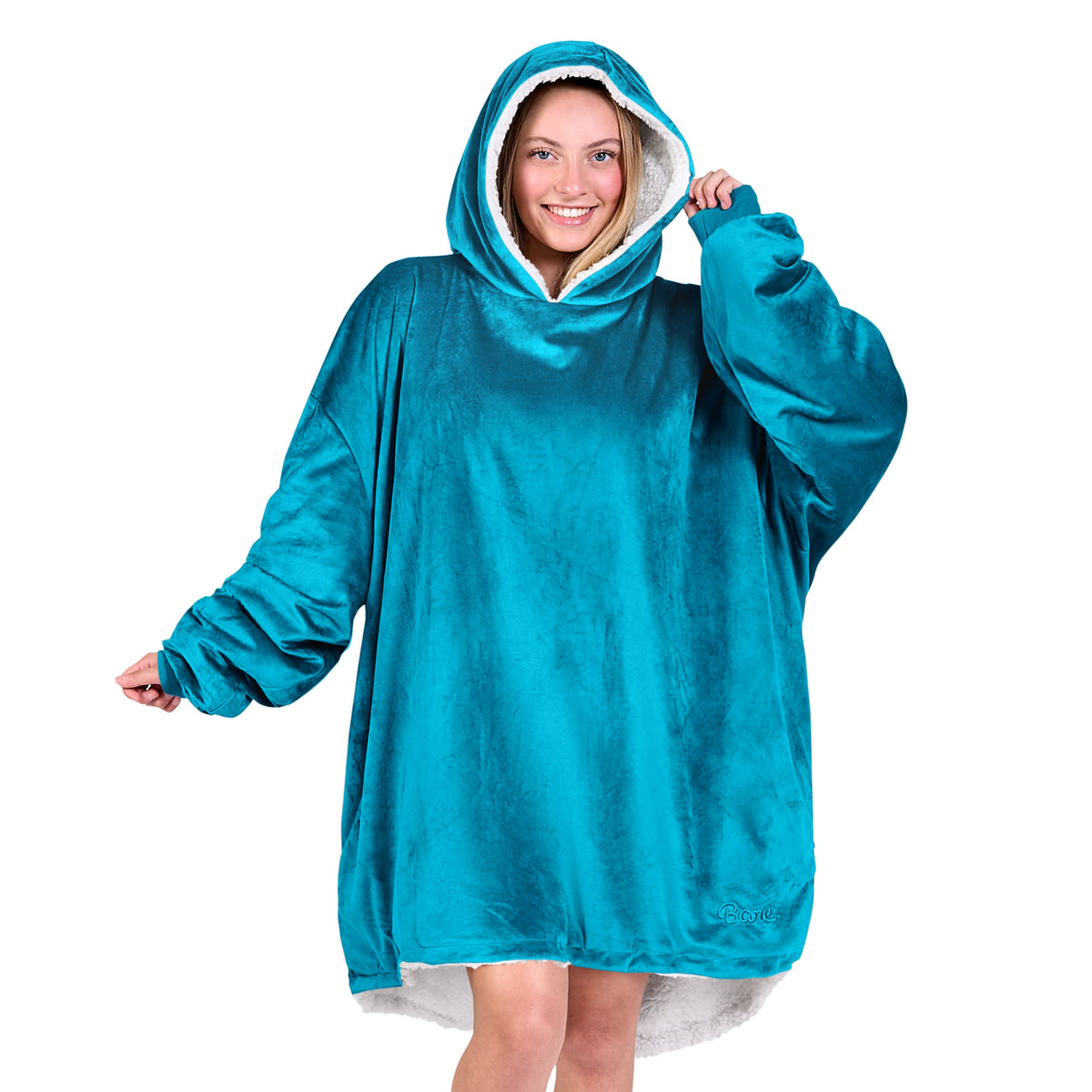 An adult with a sherpa wearable blanket on