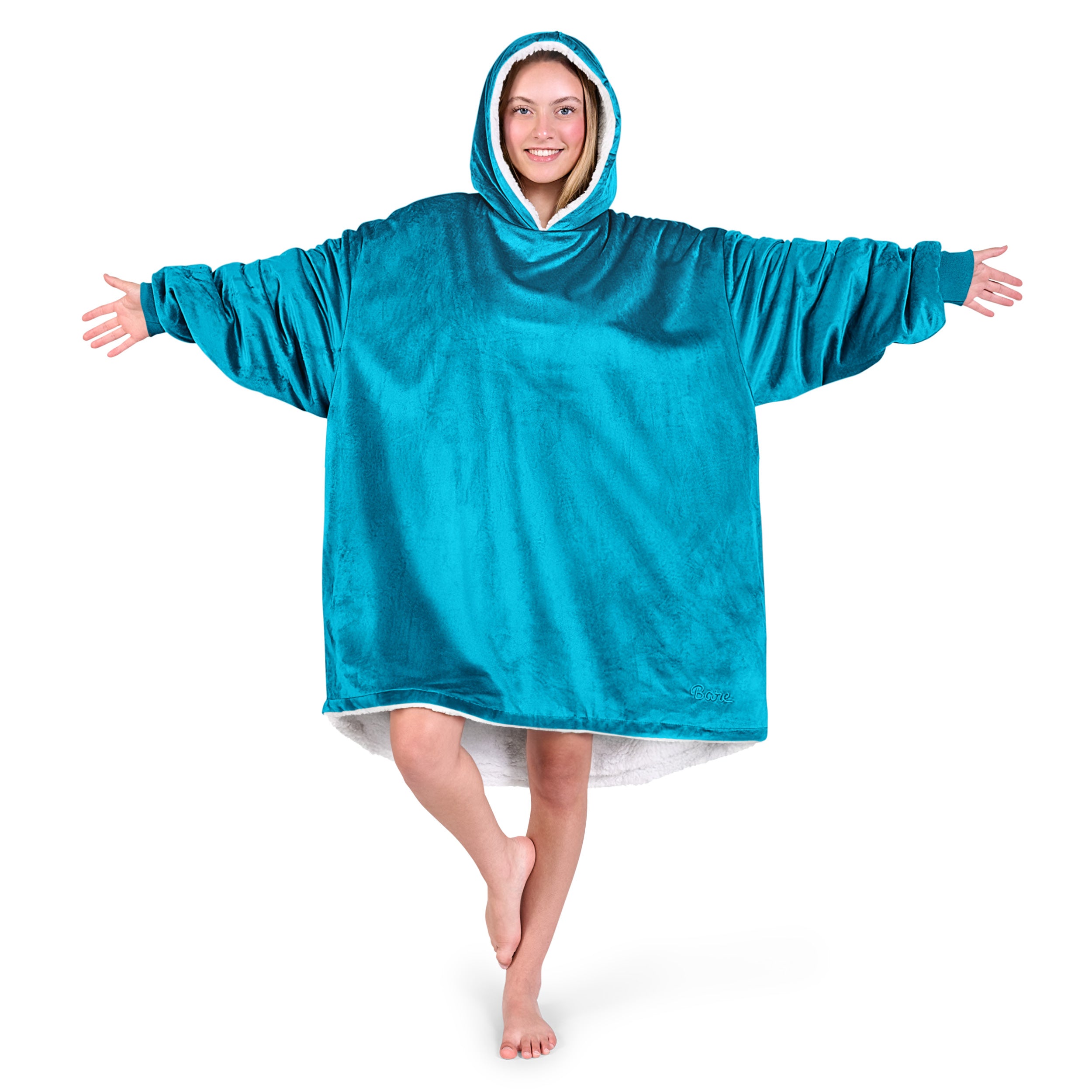 An adult with a sherpa wearable blanket on